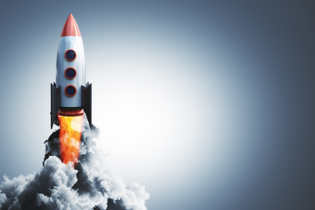 Launching rocket on gray background. Startup and begin concept. 3D Renderingの写真素材