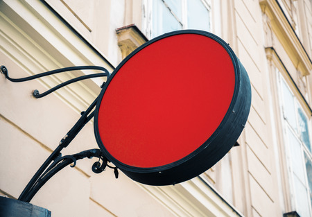 Empty round red signage on building with classical architecture and daylight. Mock upの写真素材