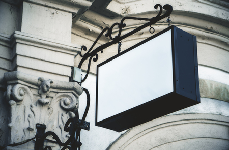 Empty white rectangular signage on building with classical architecture and daylight. Mock upの写真素材