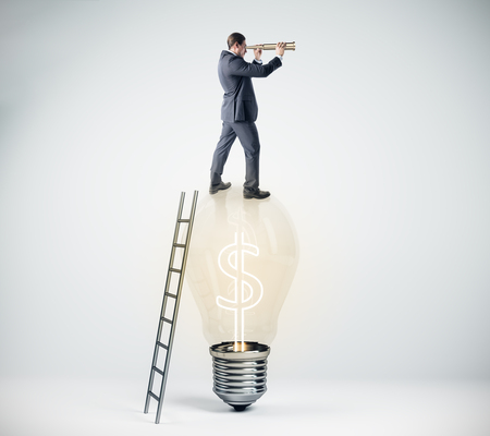 Businessman using binoculars while standing on lamp with dollar sign and ladder. Research, growth and idea concept. 3D Renderingの写真素材