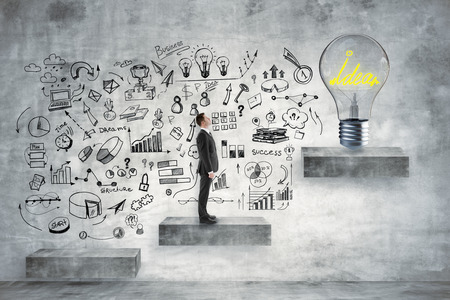 Side view of young businessman standing on concrete ladder with lamp. Idea and success concept. 3D Renderingの写真素材