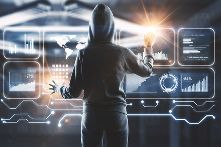 Hacker using digital business interface on blurry office interior background. Future and malware...