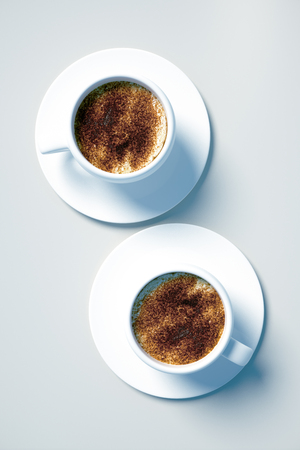 Top view of white coffee cups on light background. Morning concept. 3D Renderingの写真素材