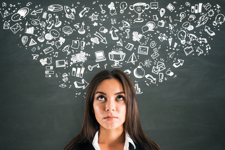 Success and leadership concept. Portrait of attractive young european businesswoman with business sketchの写真素材