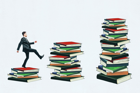 Businessman balancing on drawn book stacks. White background. Education and knowledge conceptの写真素材