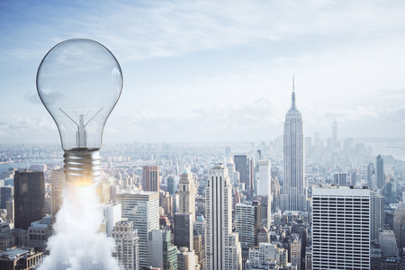 Abstract launching light bulb on new york city background. Startup and idea concept. 3D Renderingの写真素材