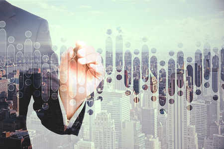 Businessman hand drawing forex chart on bright city background. Trade and future concept. Double exposureの写真素材