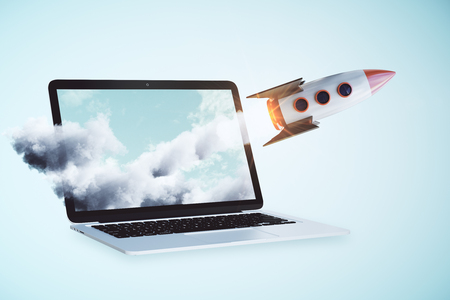 Launching rocker on laptop screen. Blue background. Online startup concept. 3D Renderingの写真素材
