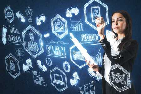 Young businesswoman with business sketch on blurry background. Management and career conceptの写真素材