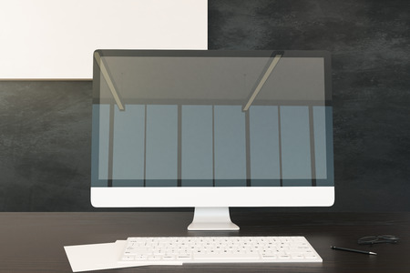 Close up of office desk with reflections on empty computer. Mock up, 3D Renderingの写真素材