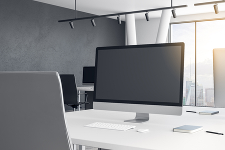 Close up of creative designer workplace with empty computer in modern office. Mock up, 3D Renderingの写真素材