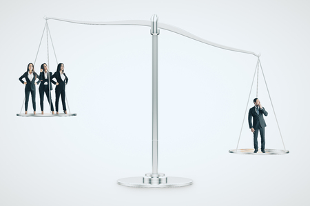 Businesswomen and men on scales. Equality and teamwork concept.の写真素材
