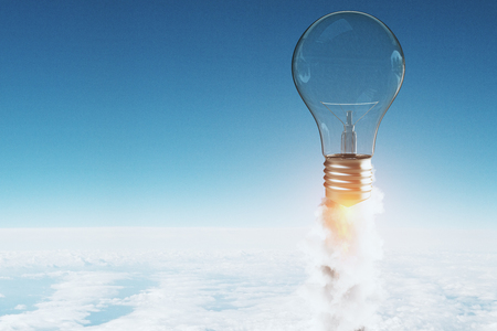 Launching light bulb on blue sky background. Startup and innovation concept. 3D Renderingの写真素材