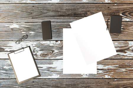 Top view and close up of contemporary wooden office desktop with empty devices and supplies. Mock up, 3D Renderingの写真素材