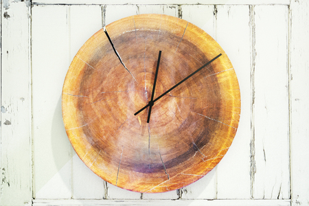 Close up of stylish round wooden clock. Design concept. 3D Rendering