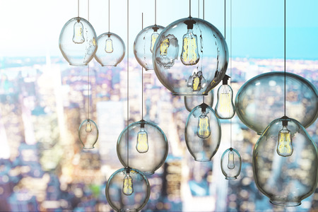 Creative lamps on blurry city background. 3D Renderingの写真素材