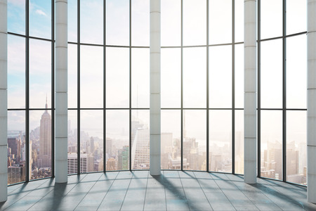 Modern office interior with panoramic New York city view and sunlight. 3D Renderingの写真素材