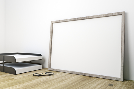 Blank frame on office desktop with supplies and concrete wall background. Mock up, 3D Renderingの写真素材