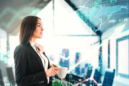 Trade and finance concept. Side view of attractive young businesswoman drinking coffee in modern office interior with forex chart and upward arrow. Double exposureの写真素材