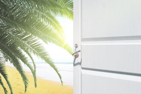 Opening white door with creative beach view. Holiday concept. 3D Renderingの写真素材