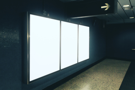 Side view of blank white underground poster on tile wall. Advertisement and commercial concept. Mock upの写真素材