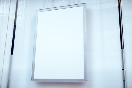 Close up of empty white street billboard on light background. Commercial and advert concept. Mock upの写真素材