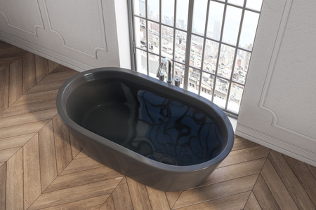 Top view of black bathtub in modern interior with wooden floor and city view. Style and design concept. 3D Renderingの写真素材