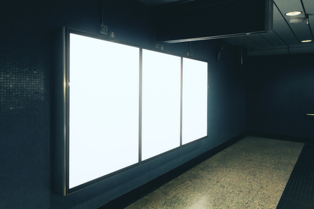 Side view of empty white underground poster on tile wall. Advertisement and commercial concept. Mock upの写真素材