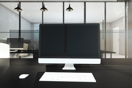 Empty computer monitor in modern office interior. Workplace concept. Mock up, 3D Renderingの写真素材