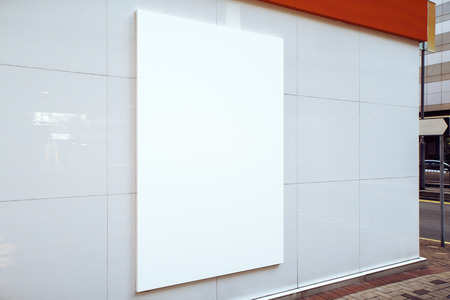 Close up of blank white street billboard on light background. Commercial and advert concept. Mock upの写真素材