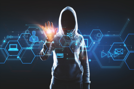 Hacker using digital business interface on blue background. Hacking and malware conceptの写真素材