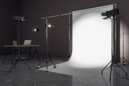 Side view of contemporary photo studio with professional lighting equipment and white background. Photgraphy concept. Mock up, 3D Renderingの写真素材