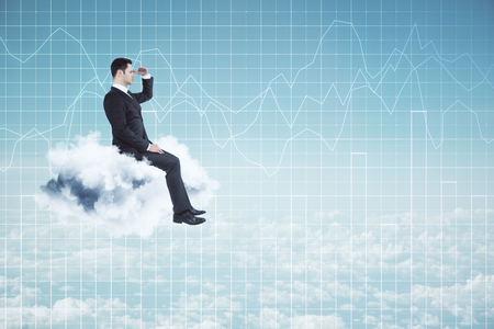 Side view of young businessman sitting on cloud while looking into the distance on sky background with forex chart grid. Forecast and vision conceptの写真素材