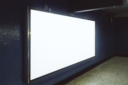 Side view of empty white underground billboard on tile wall. Advertisement and commercial concept. Mock upの写真素材
