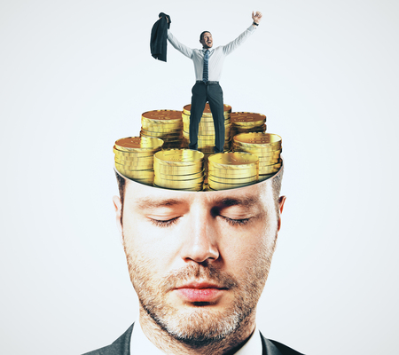 Abstract businessman face portrait with shut eyes and golden coins brain on white background. Focus and investment conceptの写真素材