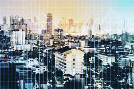 Creative city background with forex chart grid. Finance and trade concept. Double exposureの写真素材