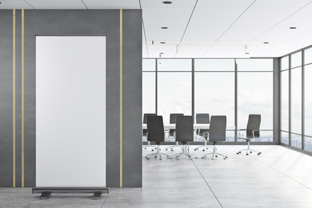 Modern meeting room interior with empty banner on concrete wall, panoramic city view, daylight and...