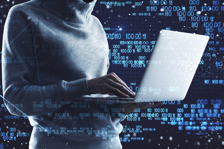 Side view and close up of hacker using laptop with creative binary code interface. Software and malware concept. Double exposureの写真素材