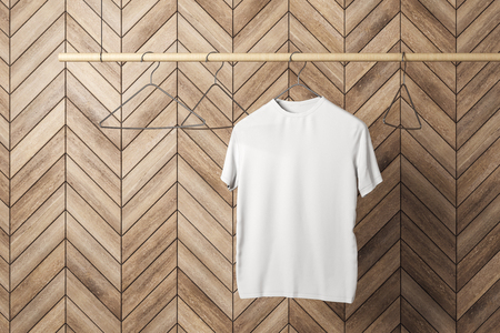 Empty one white tshirt on hanger. Wooden tile wall background. Design, store and style concept. Mock up, 3D Renderingの写真素材