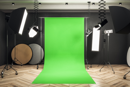 Modern photo studio interior with green background, professional equipment and wooden floor. Mock up, 3D Renderingの写真素材