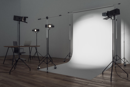 Side view of modern photo studio with professional lighting equipment and white background. Photgraphy concept. Mock up, 3D Renderingの写真素材
