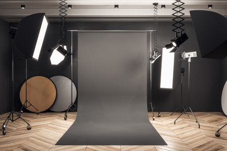 Modern photo studio interior with black background, professional equipment and wooden floor. Mock up, 3D Renderingの写真素材