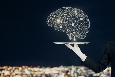 Hand with creative circuit brain on blurry night city background. Artificial intelligence and service concept.の写真素材