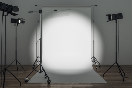 Modern photo studio with professional lighting equipment and white background. Photgraphy concept. Mock up, 3D Renderingの写真素材