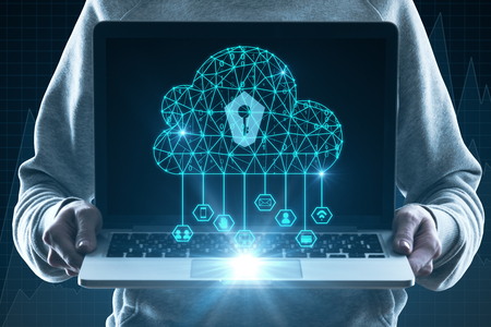Hands holding laptop with glowing polygonal cloud and keyhole. Cloud computing and internet safety concept. Double exposureの写真素材