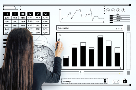 Businesswoman drawing creative business sketch on concrete wall. Finance and economy conceptの写真素材