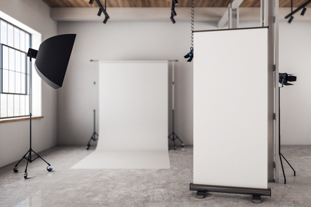 Modern photo studio interior with empty poster and daylight. Mock up, 3D Renderingの写真素材