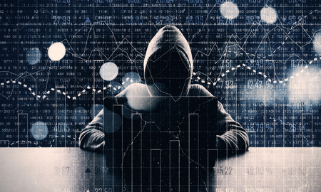 Hacker at desktop and bokeh background using laptop with glowing forex chart. Hacking and trade...