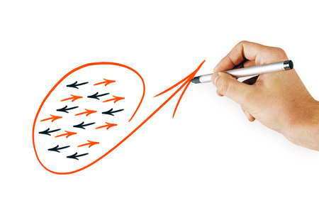 Hand drawing creative arrow sketch on white concrete wall background. Different direction and success conceptの写真素材