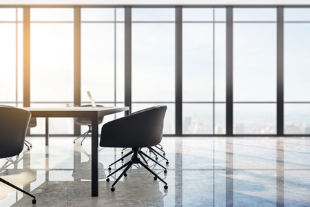 Bright meeting room interior with panoramic city view, furniture, laptop on desktop and daylight. Toned image. 3D Renderingの写真素材